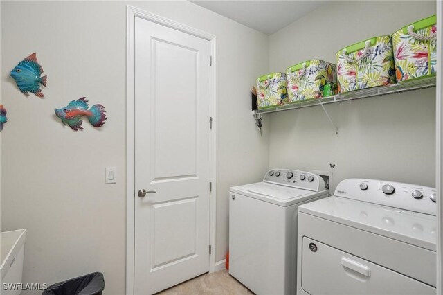 laundry room featuring separate washer and dryer