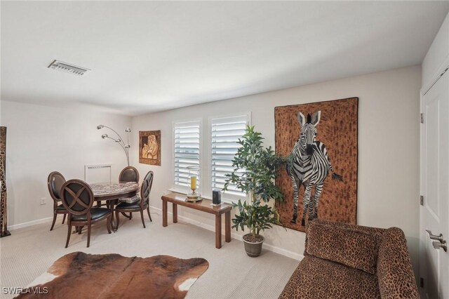 view of carpeted dining space