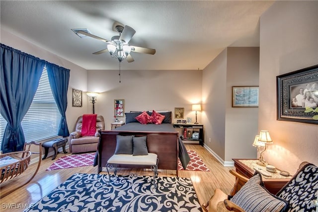 bedroom featuring ceiling fan and light hardwood / wood-style flooring