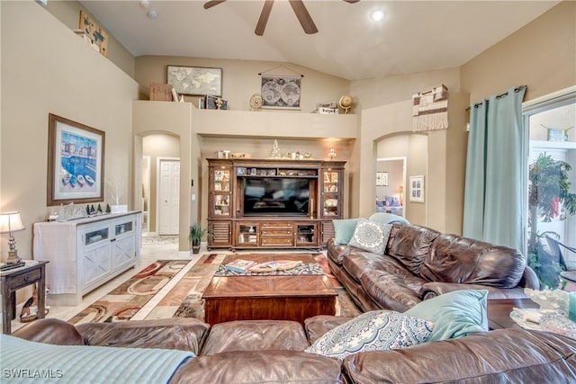 living room with ceiling fan and vaulted ceiling