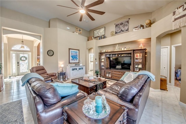 living room with ceiling fan, french doors, and light tile patterned floors