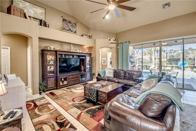 living room with ceiling fan and lofted ceiling