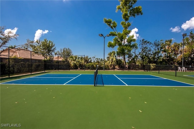 view of sport court with basketball hoop