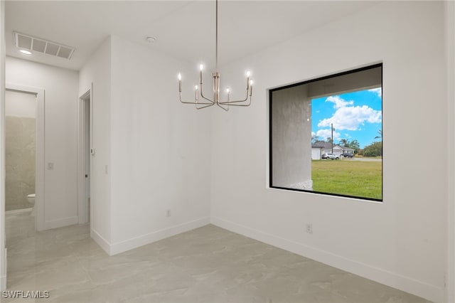 unfurnished dining area featuring an inviting chandelier