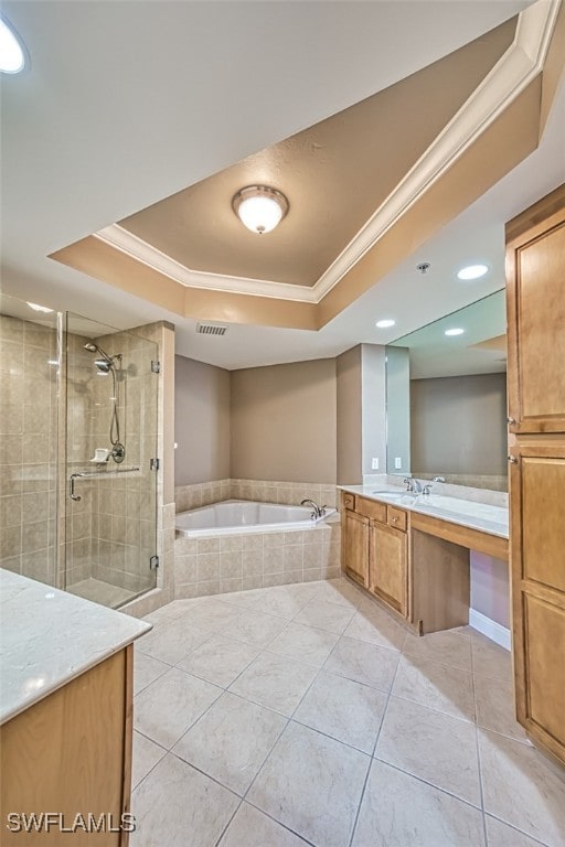 bathroom featuring a raised ceiling, plus walk in shower, tile patterned floors, and vanity