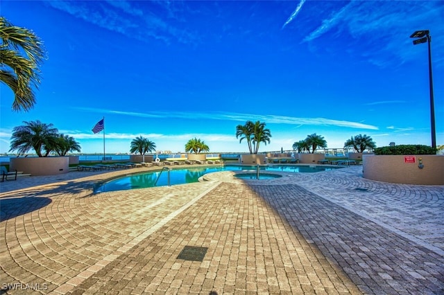 view of swimming pool with a patio area