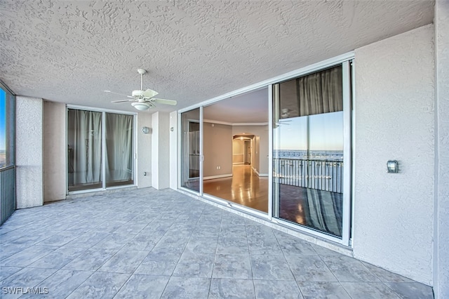 view of patio featuring ceiling fan