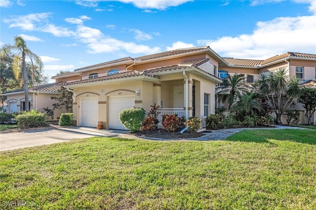 mediterranean / spanish house with a front yard and a garage