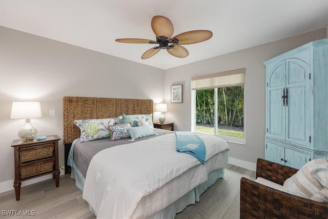 bedroom featuring ceiling fan and light hardwood / wood-style floors