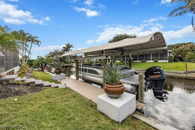 dock area with a water view and a yard