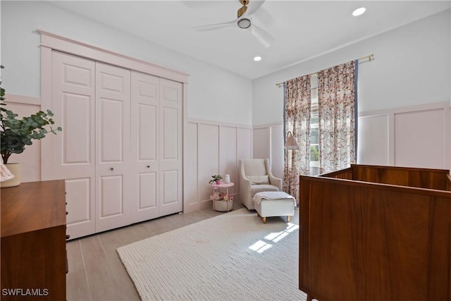 bedroom with ceiling fan and a closet