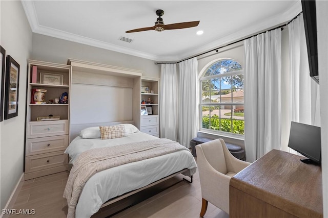 bedroom featuring ceiling fan and crown molding