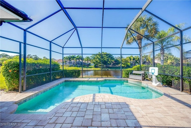 view of swimming pool with a lanai, a patio area, and a water view