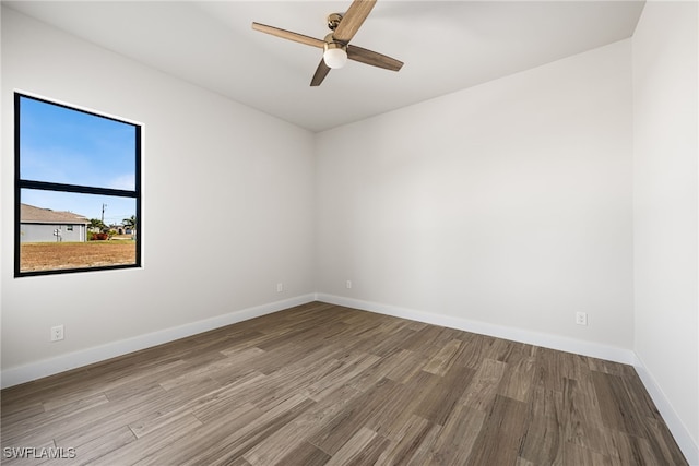 spare room featuring ceiling fan and wood-type flooring