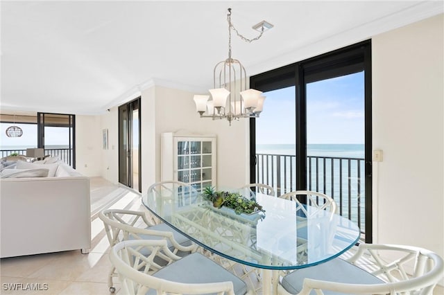 dining space featuring a water view, light tile patterned floors, and a chandelier