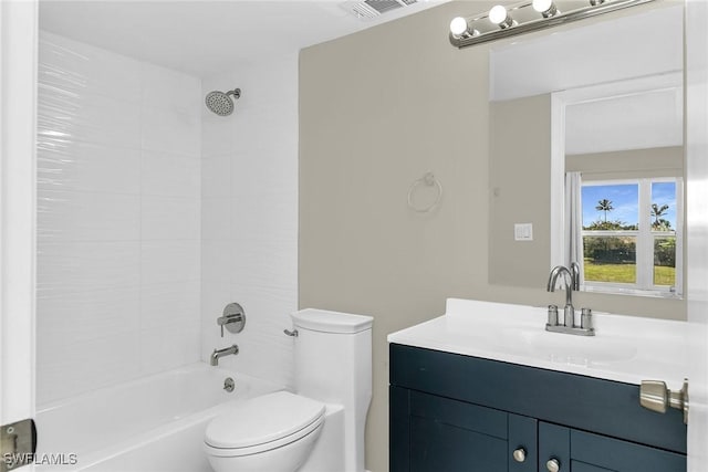 full bathroom with vanity, toilet, and tiled shower / bath combo