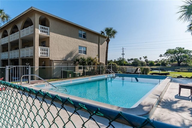 view of pool with cooling unit