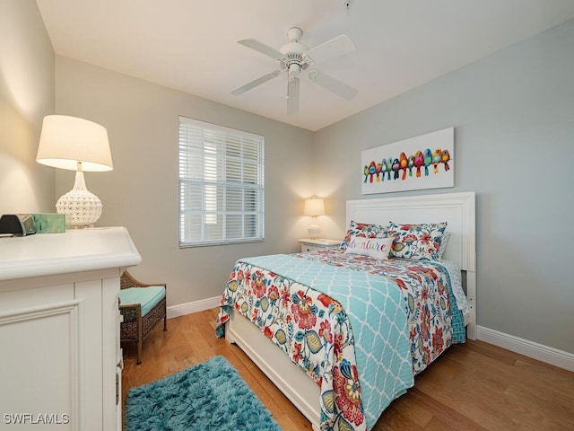 bedroom featuring ceiling fan and hardwood / wood-style flooring