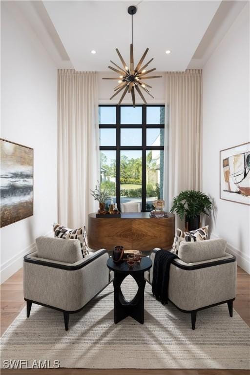 interior space featuring a notable chandelier and light hardwood / wood-style flooring