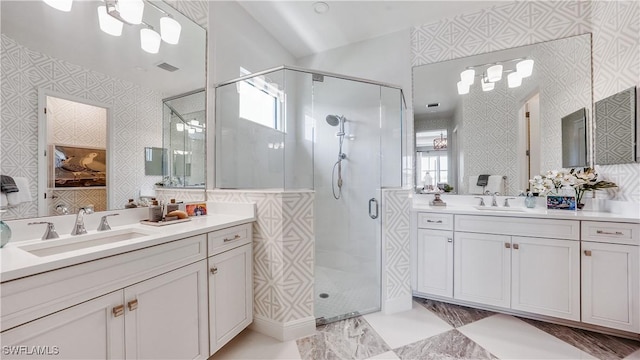 bathroom featuring vanity and walk in shower