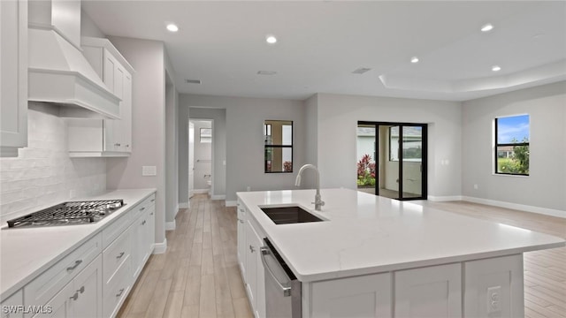4075 Pegasus Way, Naples, FL 34120 - kitchen featuring a sink, wall chimney exhaust hood, stainless steel appliances, baseboards, and recessed lighting