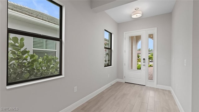 4075 Pegasus Way, Naples, FL 34120 - entrance foyer with plenty of natural light, light wood-type flooring, and baseboards