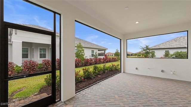 4075 Pegasus Way, Naples, FL 34120 - unfurnished sunroom featuring healthy amount of natural light and recessed lighting