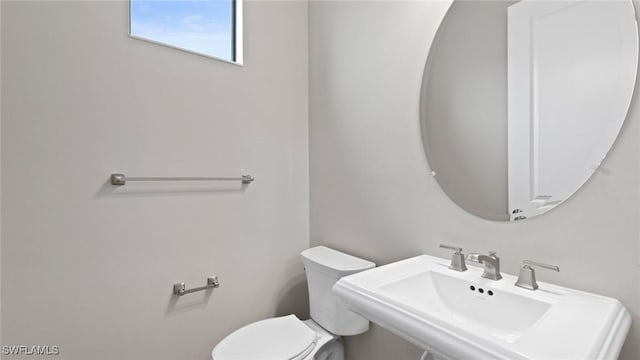 4075 Pegasus Way, Naples, FL 34120 - half bathroom featuring a sink and toilet