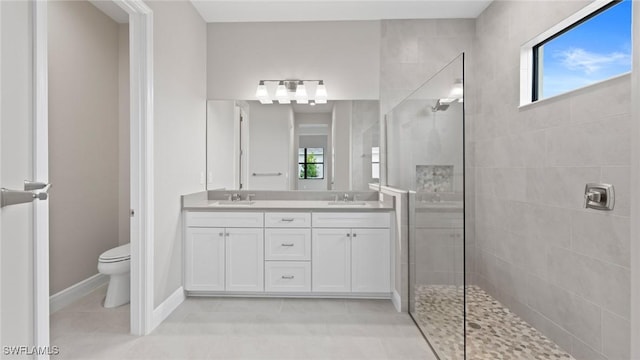 4075 Pegasus Way, Naples, FL 34120 - bathroom featuring walk in shower, double vanity, toilet, tile patterned flooring, and baseboards
