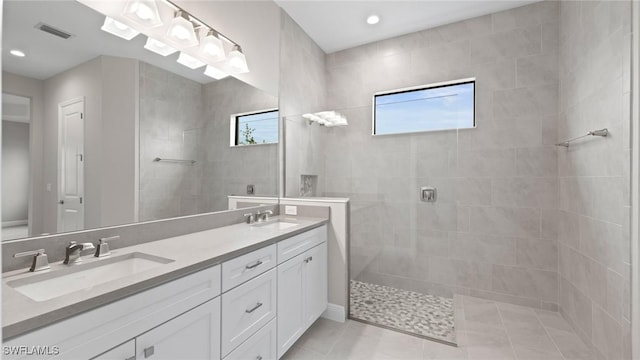 4075 Pegasus Way, Naples, FL 34120 - bathroom featuring double vanity, a walk in shower, tile patterned flooring, and recessed lighting