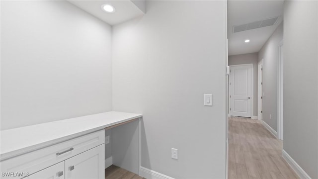 4075 Pegasus Way, Naples, FL 34120 - unfurnished office with baseboards, light wood-style flooring, built in desk, and recessed lighting