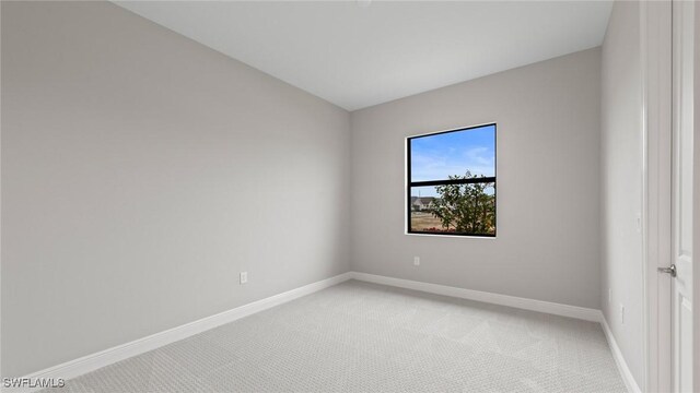 4075 Pegasus Way, Naples, FL 34120 - unfurnished room featuring light colored carpet and baseboards