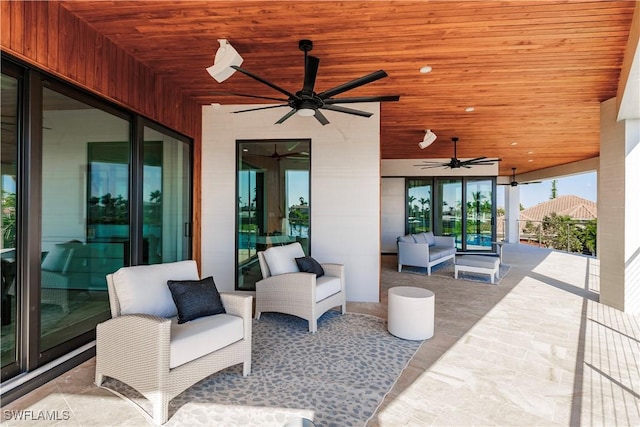 view of patio featuring ceiling fan and an outdoor living space