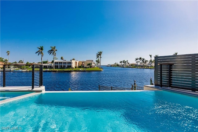 view of pool with a water view