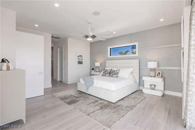 bedroom featuring ceiling fan and light hardwood / wood-style flooring