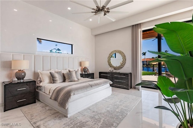 bedroom featuring multiple windows and ceiling fan