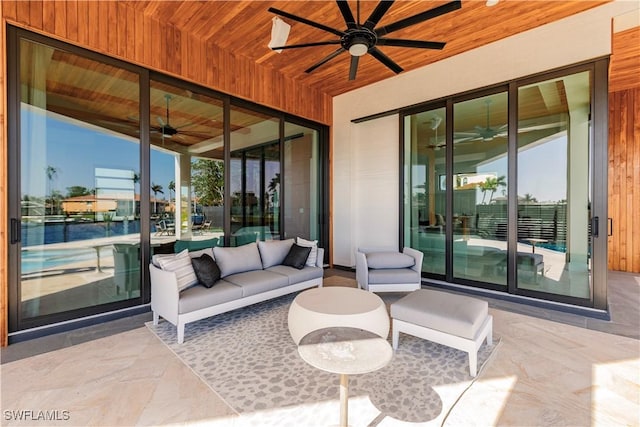 view of patio with ceiling fan and outdoor lounge area