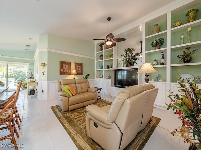 tiled living room featuring built in features and ceiling fan