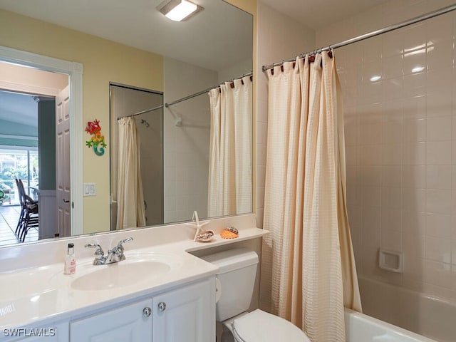 full bathroom featuring toilet, vanity, and shower / tub combo with curtain