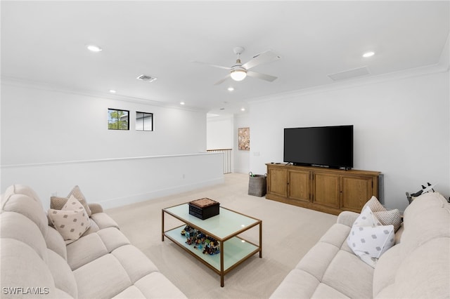 living room with ornamental molding, ceiling fan, and light colored carpet