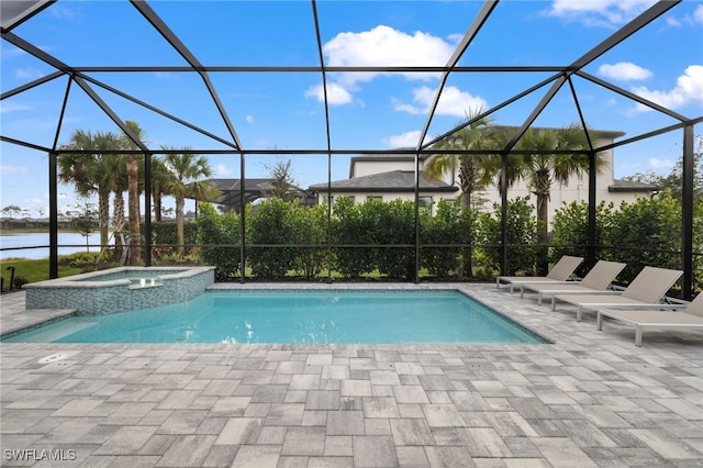 view of pool with a patio, a lanai, an in ground hot tub, and a water view