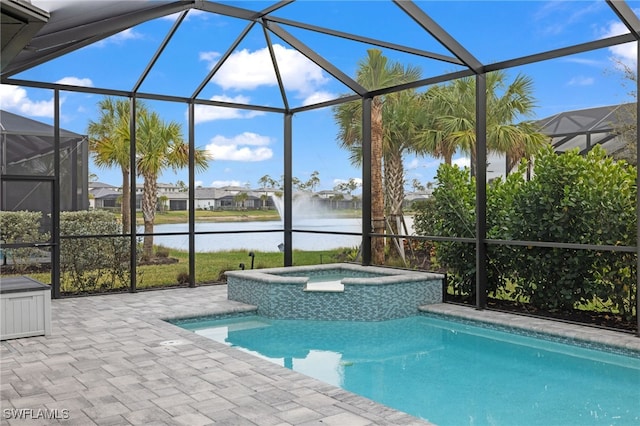 view of pool with a lanai, an in ground hot tub, and a water view