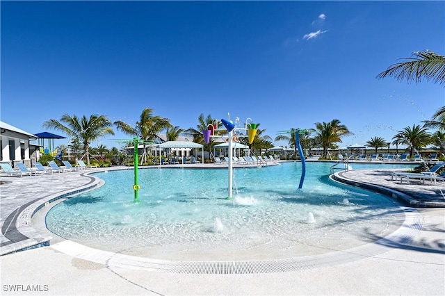 view of pool with pool water feature