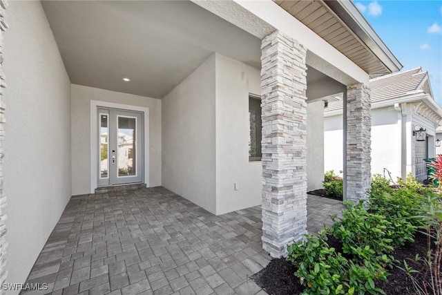 doorway to property with a patio and french doors