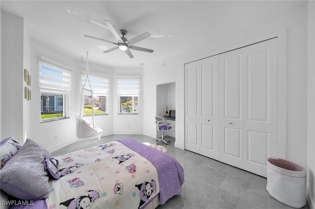 bedroom with ceiling fan and a closet