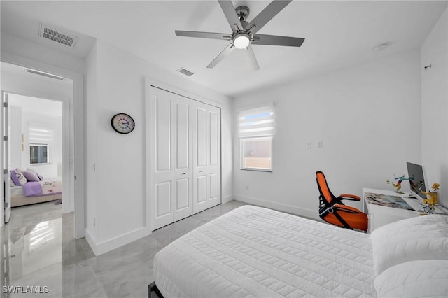 bedroom with ceiling fan and a closet