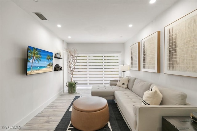 living room with light hardwood / wood-style floors