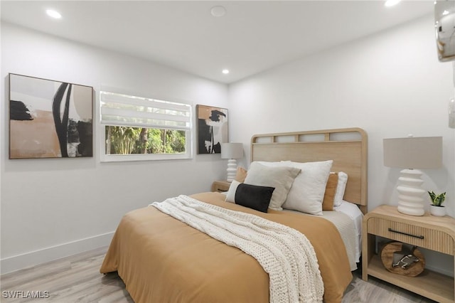 bedroom with light hardwood / wood-style flooring