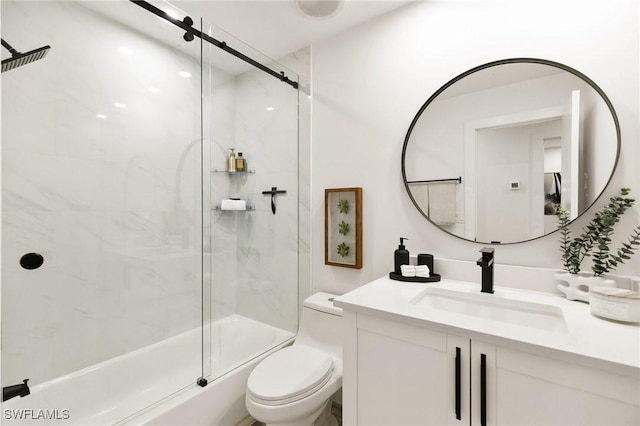 full bathroom featuring toilet, enclosed tub / shower combo, and vanity