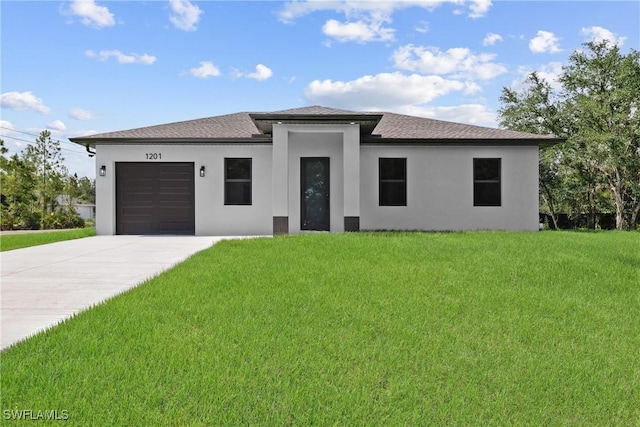 1201 E 7th St, Lehigh Acres, FL 33972 - prairie-style home with stucco siding, a garage, a front lawn, concrete driveway, and a shingled roof